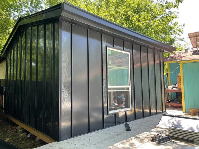 Black standing seam metal wall panels for Roof Inspection in Garwood